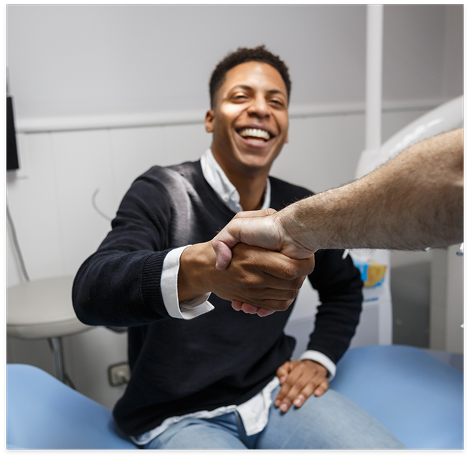 Dental patient shaking dentists hand