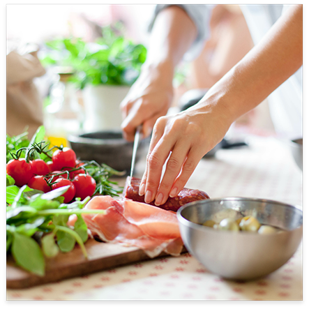 Close up of healthy foods being cut with knife