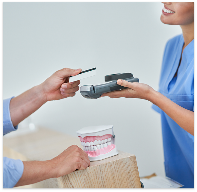 Handing credit card to team member holding scanning device