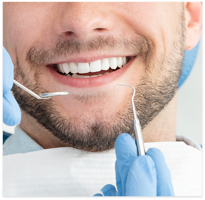 Close up of smile and dental instruments