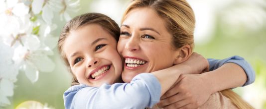 Little girl hugging her mother