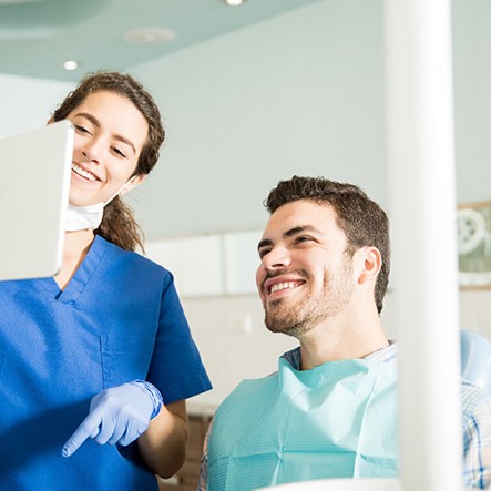 Dentist explains something to patient