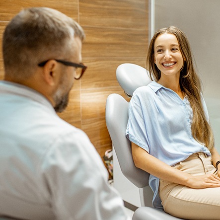 Lady smiles at dentist