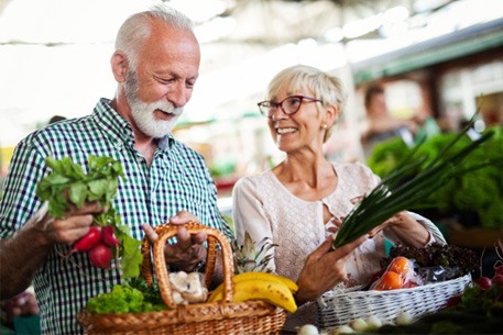 older couple shopping for healthy food