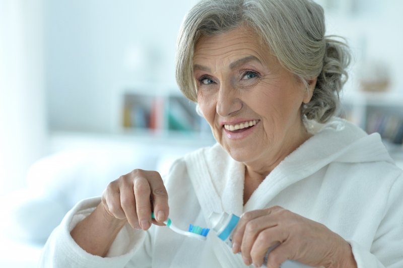 Patient brushing their teeth for better oral health